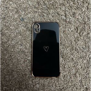 Black and rose gold phone case with hearts in the middle. For a iPhone XR.